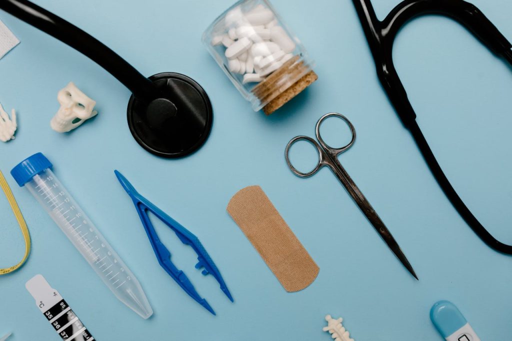 The Art of Drawing Readers In: Your attractive post title goes here Flat lay of assorted medical tools and equipment on a blue surface.
