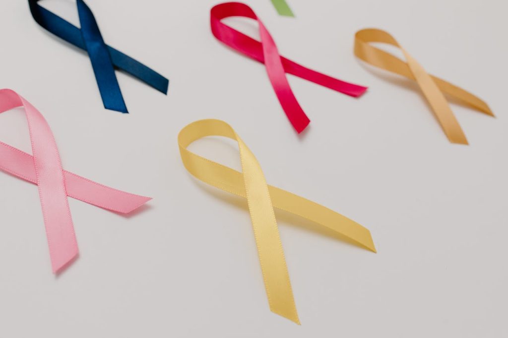 Crafting Captivating Headlines: Your awesome post title goes here A collection of colorful awareness ribbons symbolizing various causes on a white surface.